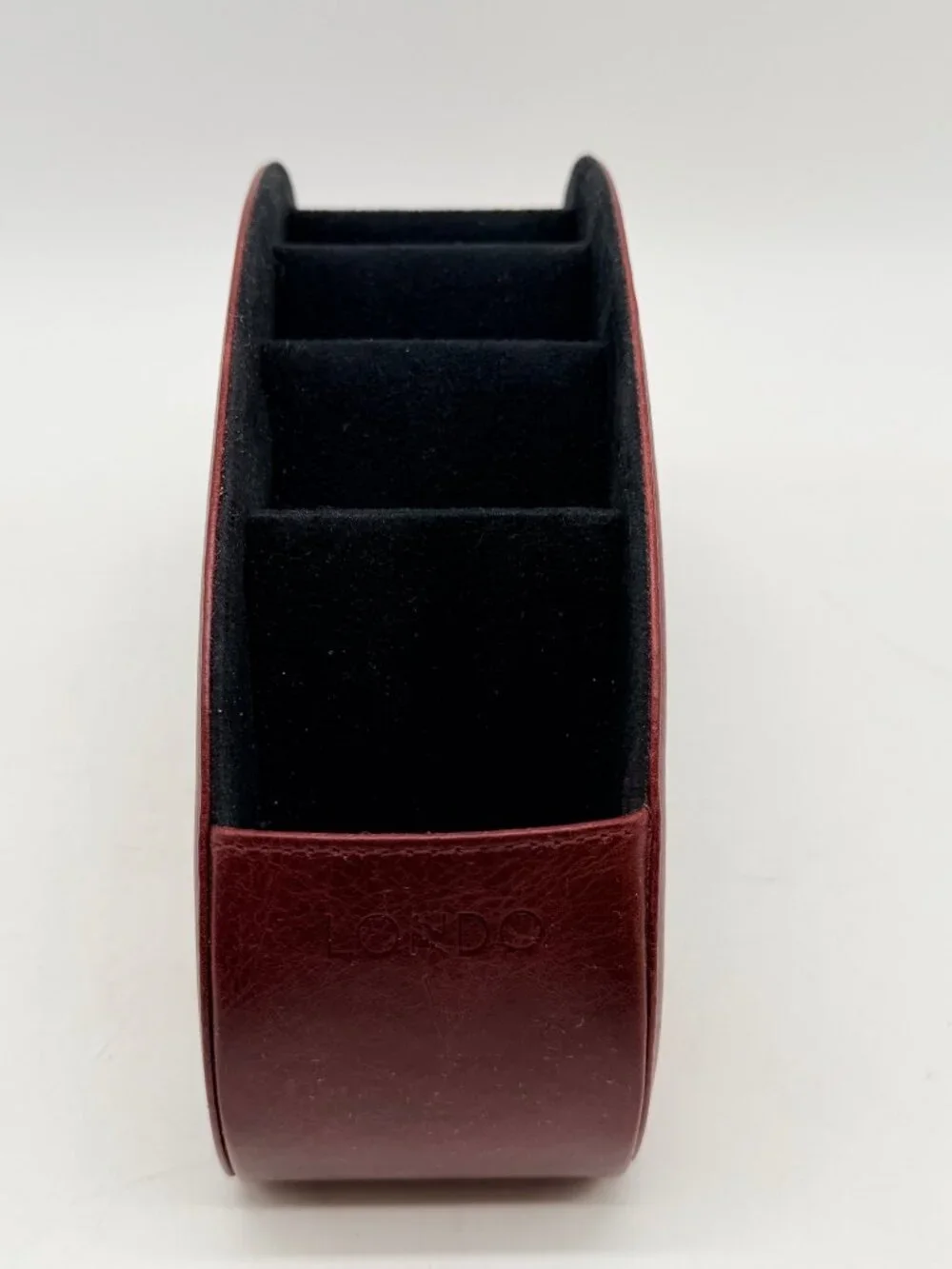 red Londo brand remote control holder features five compartments for organizatio